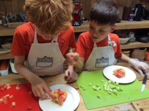 Children taking part in the Family Cooking class